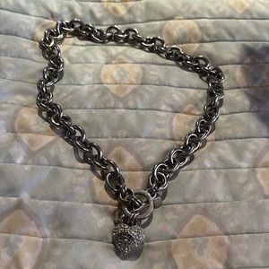 Woman’s necklace with heart charm